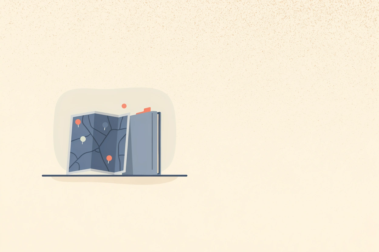A folded paper map with pins beside a records folder